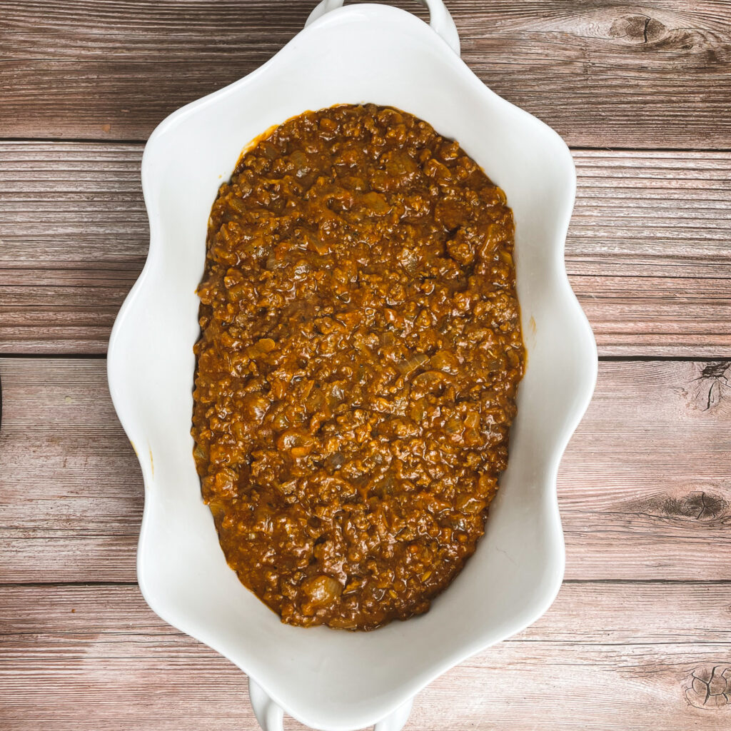 ground beef mixture in a white casserole dish