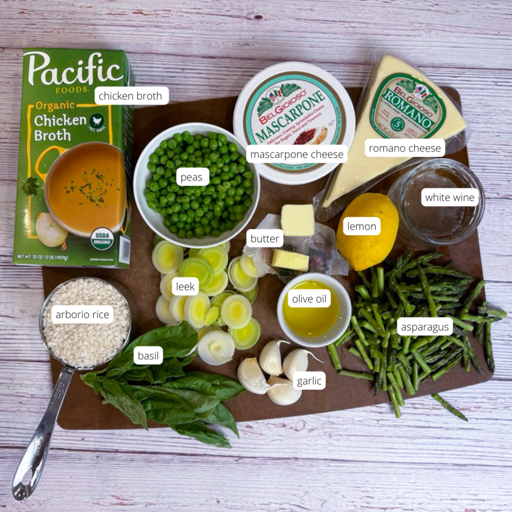 ingredients for spring pea and asparagus risotto prepared and laid out on a cutting board.