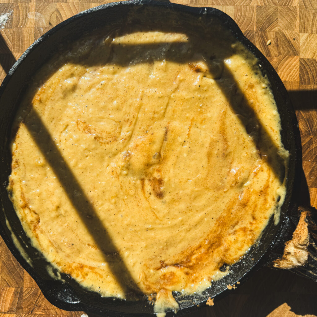 Second batter layer: Apple skillet cake layered with brown butter cake batter over cinnamon apples and brown sugar.